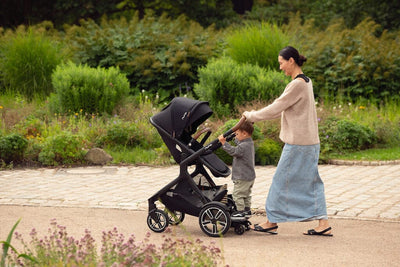 Nuna DEMI Next + Rider Board and PIPA urbn Travel System in Caviar